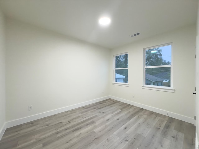 unfurnished room featuring light wood-type flooring