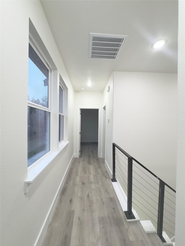 hallway with light wood-type flooring