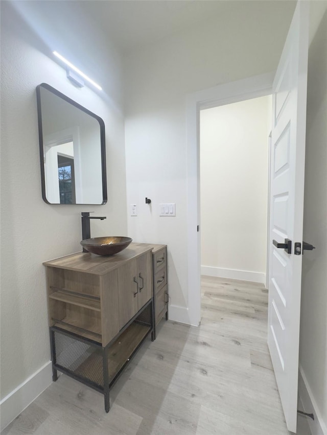 bathroom featuring hardwood / wood-style floors and vanity