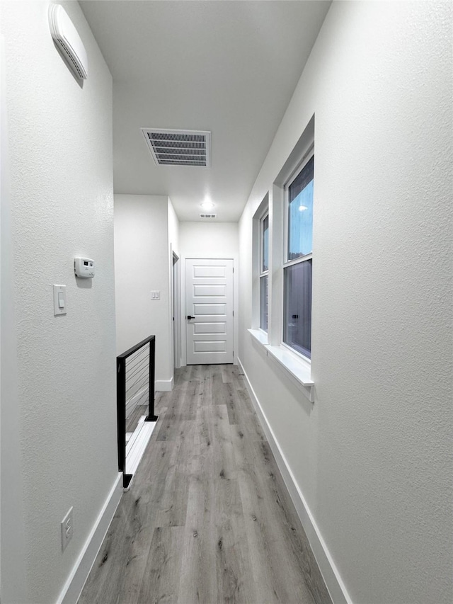 hallway featuring light wood-type flooring