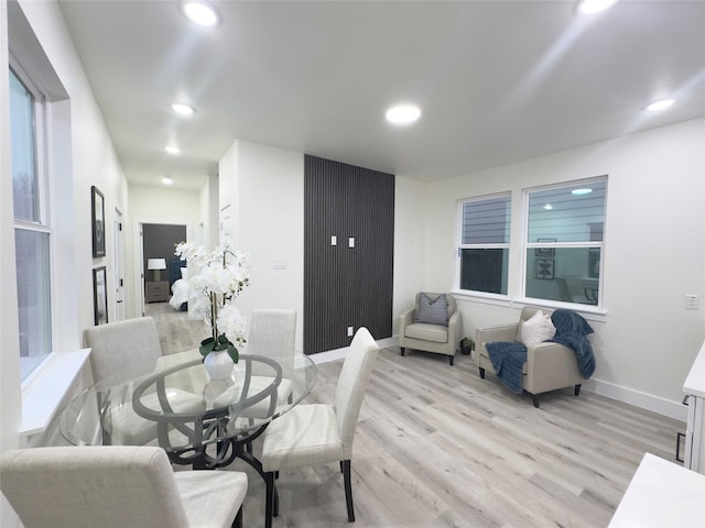 dining space featuring light wood-type flooring