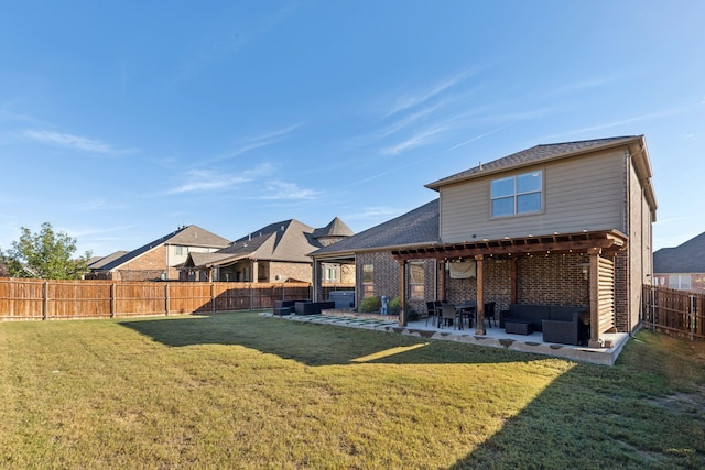 back of property featuring a lawn and a patio