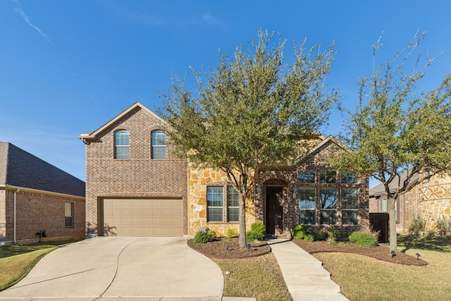 front facade featuring a front lawn and a garage