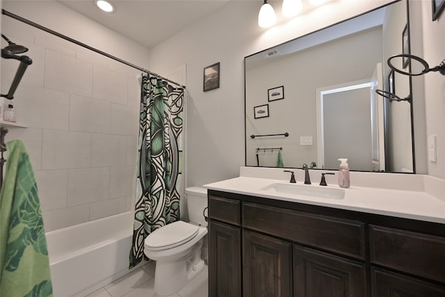 full bathroom featuring toilet, vanity, shower / bath combo with shower curtain, and tile patterned floors