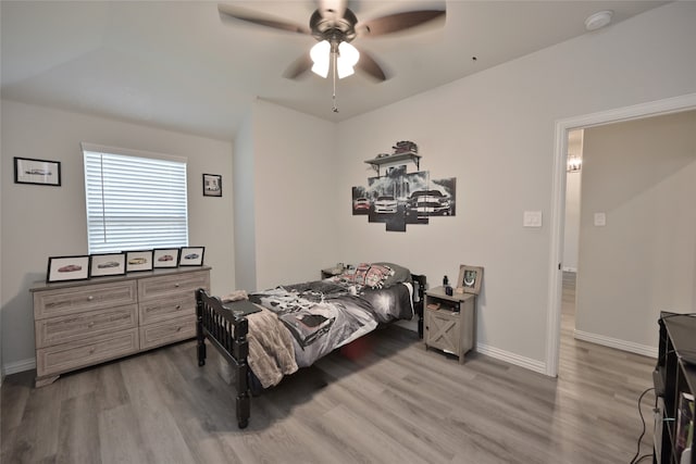 bedroom featuring hardwood / wood-style flooring and ceiling fan