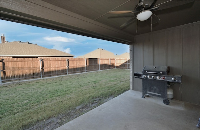 view of patio with a grill and ceiling fan