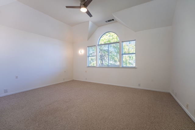 spare room with carpet flooring, ceiling fan, and vaulted ceiling