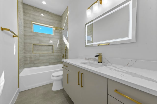 full bathroom with tile patterned flooring, vanity, toilet, and tiled shower / bath