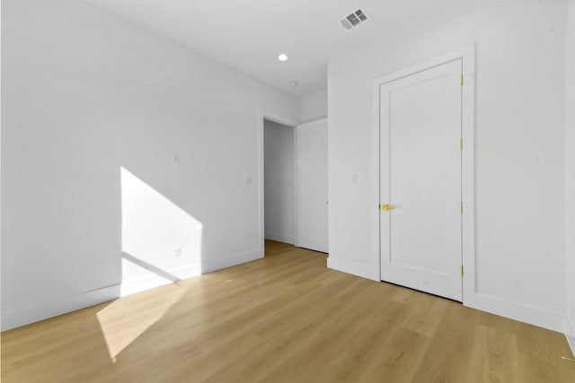 unfurnished bedroom featuring light wood-type flooring