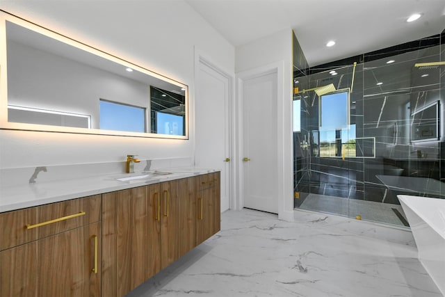 bathroom with vanity and shower with separate bathtub