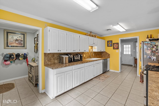 kitchen featuring white cabinets, crown molding, and appliances with stainless steel finishes