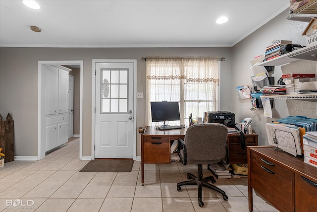 home office featuring a healthy amount of sunlight, light tile patterned floors, and crown molding