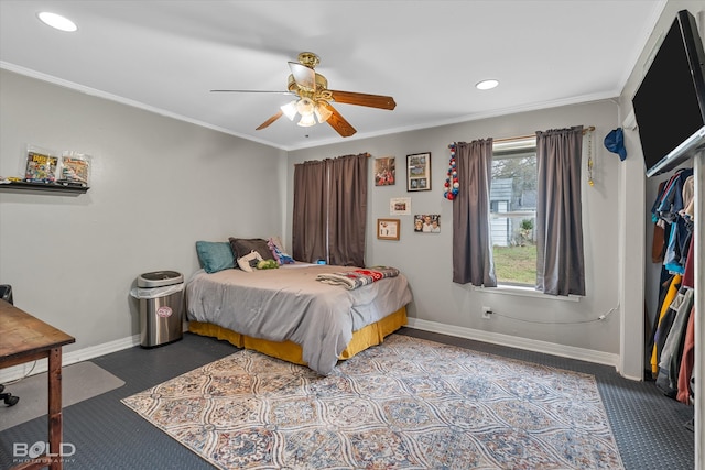 carpeted bedroom with ceiling fan and crown molding