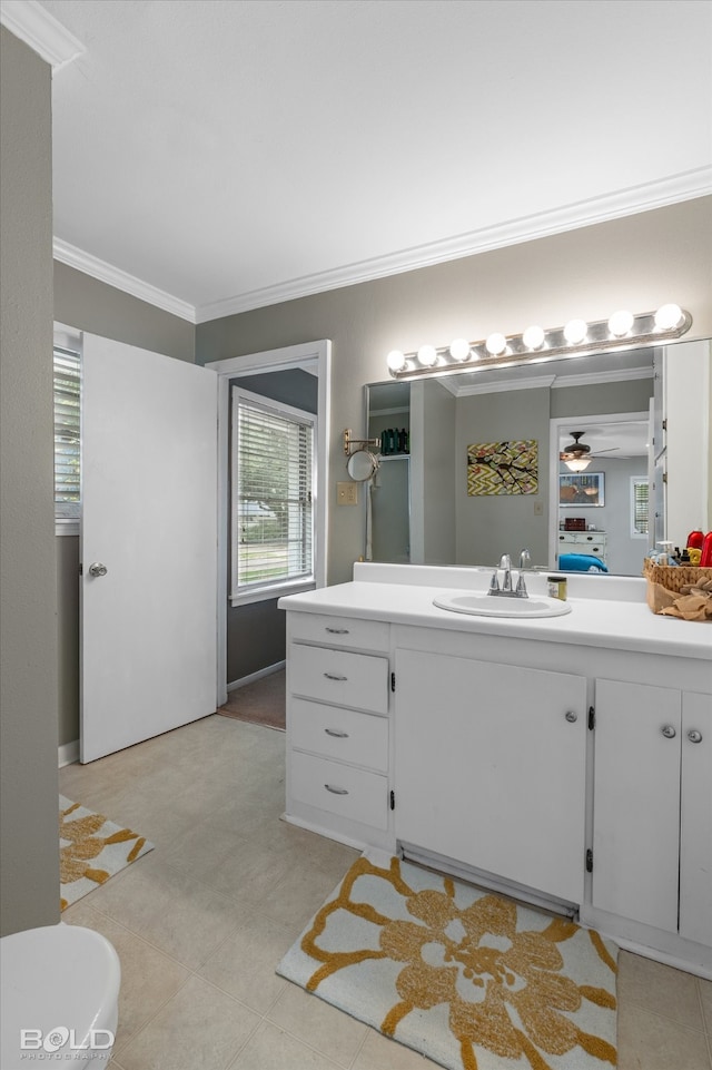 bathroom featuring crown molding, vanity, and ceiling fan