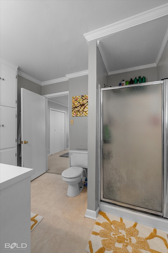 bathroom with crown molding, an enclosed shower, and toilet