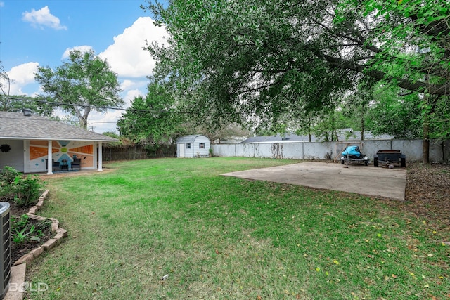 view of yard with a patio area and a shed