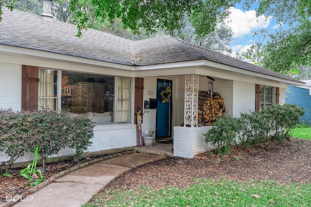 doorway to property with a porch