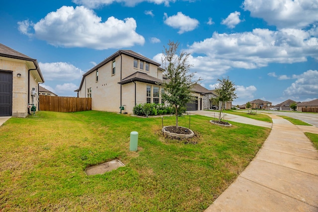 view of property exterior featuring a lawn and a garage