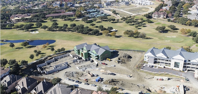 bird's eye view with a residential view, a water view, and golf course view