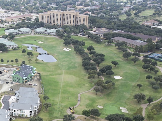 aerial view with view of golf course and a water view