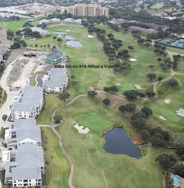 aerial view featuring a water view and golf course view