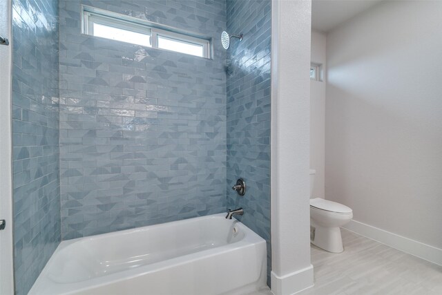 9813 Aiken Ct, Mesquite, TX 75126 - full bath featuring toilet, tub / shower combination, and baseboards