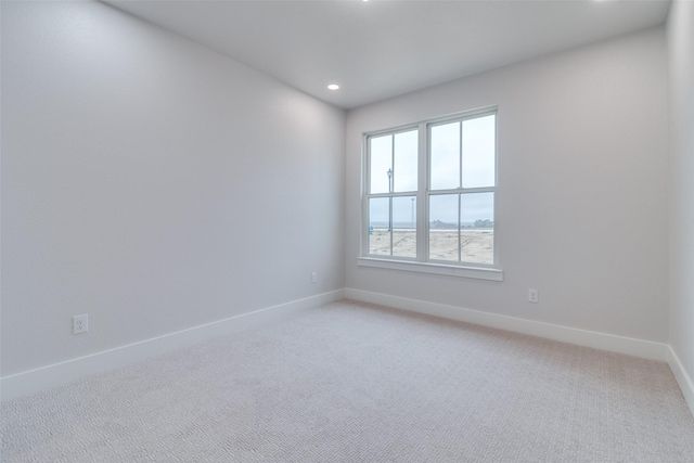 9813 Aiken Ct, Mesquite, TX 75126 - unfurnished room with baseboards, light carpet, and recessed lighting