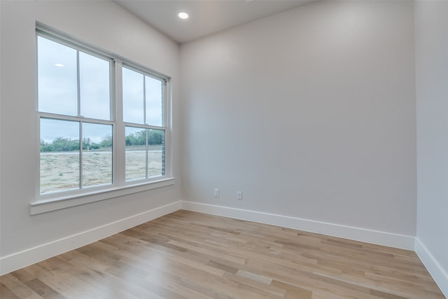 unfurnished room with light hardwood / wood-style flooring