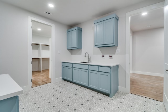 9813 Aiken Ct, Mesquite, TX 75126 - laundry area featuring a sink, recessed lighting, and baseboards