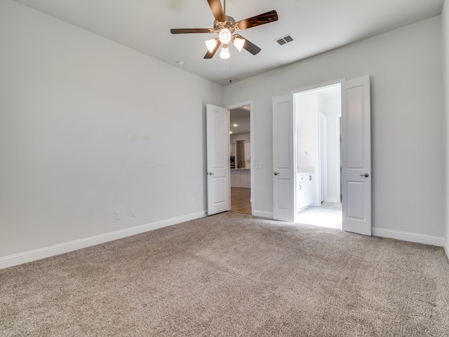 unfurnished bedroom with carpet and ceiling fan