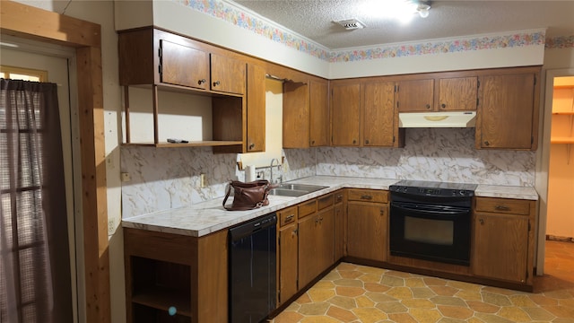 kitchen featuring a textured ceiling, sink, black appliances, and tasteful backsplash