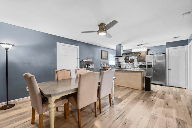 1246 Woodburn Trl, Dallas, TX 75241 - dining room with light wood finished floors and a ceiling fan
