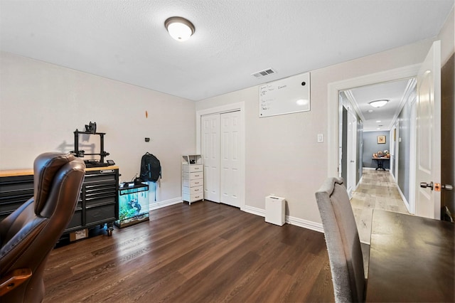 1246 Woodburn Trl, Dallas, TX 75241 - home office featuring wood finished floors, baseboards, and a textured ceiling