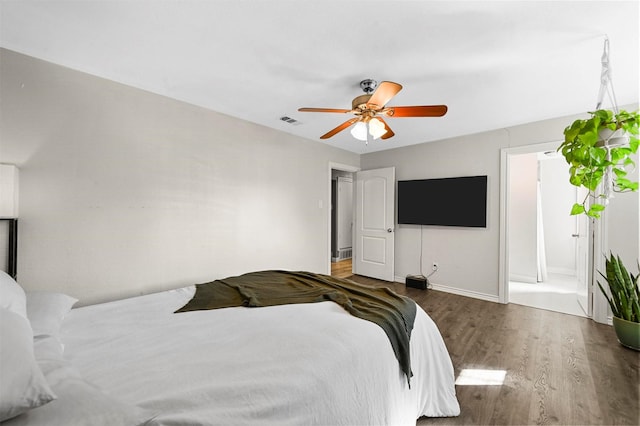 1246 Woodburn Trl, Dallas, TX 75241 - bedroom with wood finished floors, baseboards, and a ceiling fan
