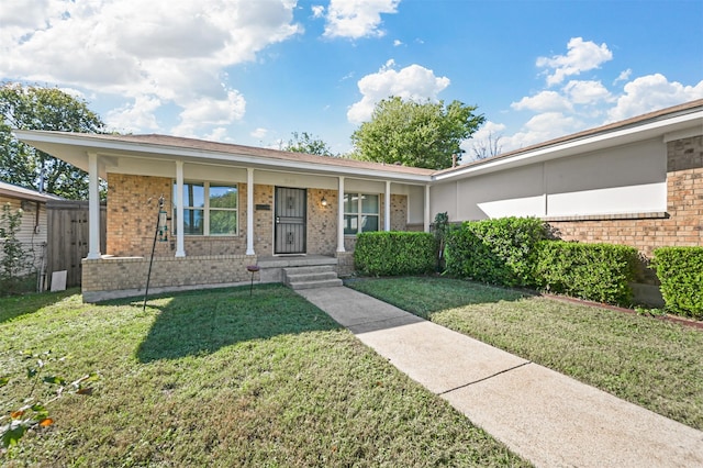 ranch-style home featuring a porch and a front lawn