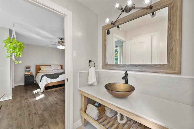 1246 Woodburn Trl, Dallas, TX 75241 - ensuite bathroom featuring wood finished floors, a ceiling fan, baseboards, and vanity