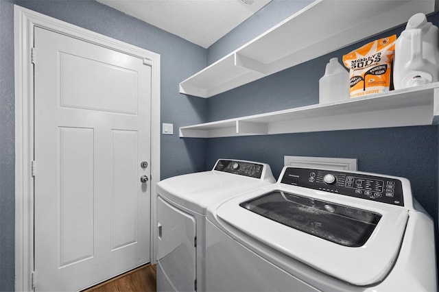 1246 Woodburn Trl, Dallas, TX 75241 - laundry room with washer and clothes dryer and dark wood-type flooring