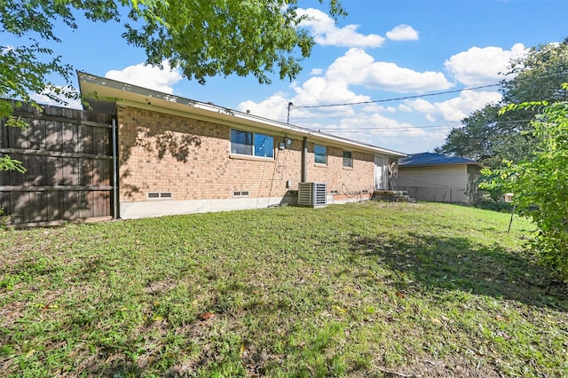 1246 Woodburn Trl, Dallas, TX 75241 - back of house featuring central AC and brick siding