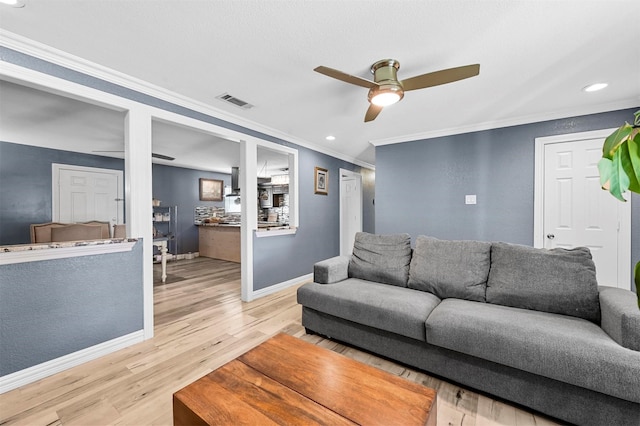 1246 Woodburn Trl, Dallas, TX 75241 - living area with a ceiling fan, ornamental molding, light wood-style floors, recessed lighting, and baseboards
