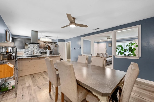 1246 Woodburn Trl, Dallas, TX 75241 - dining space featuring a ceiling fan and light wood-style floors