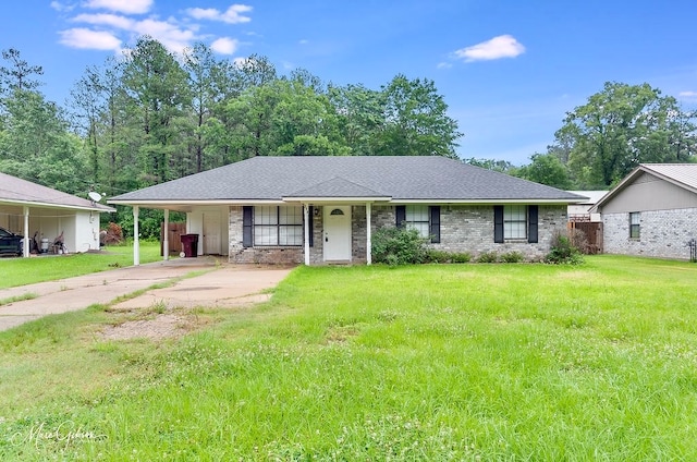 ranch-style home featuring a front yard and a carport