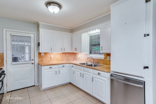 kitchen featuring white cabinetry, sink, ornamental molding, light tile patterned floors, and decorative backsplash