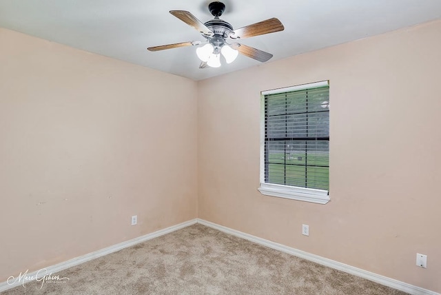 unfurnished room with ceiling fan and light colored carpet