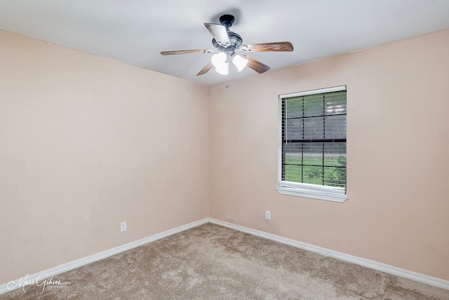 carpeted empty room with ceiling fan