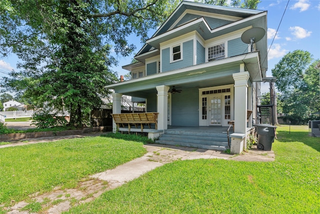 view of front of property featuring a front lawn and covered porch