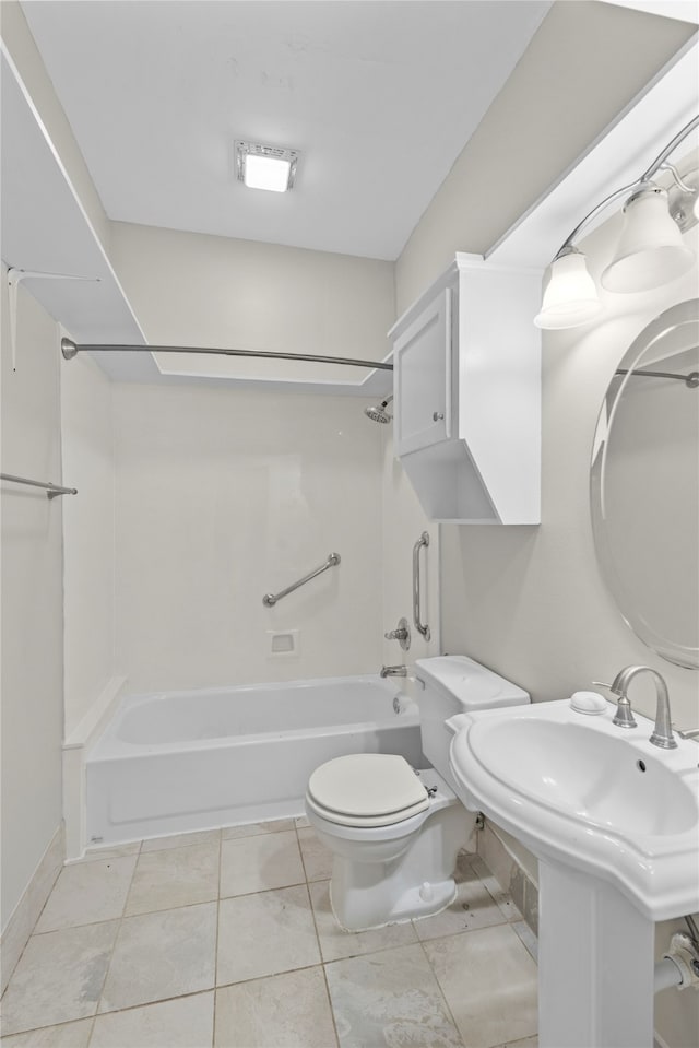 full bathroom featuring toilet, tile patterned flooring, sink, and shower / washtub combination