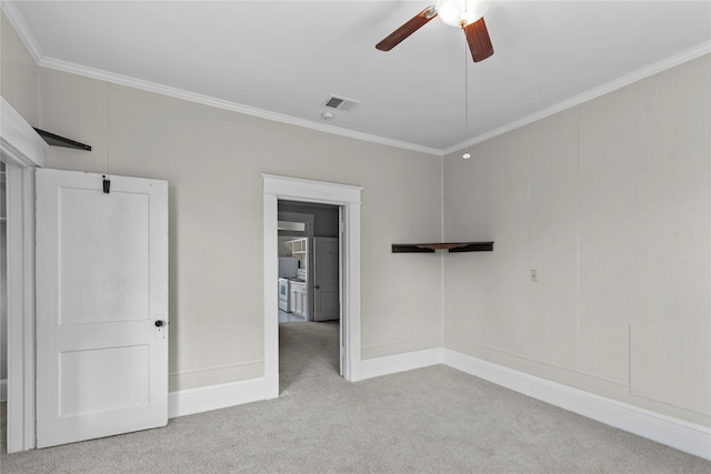 unfurnished bedroom with ornamental molding, light colored carpet, and ceiling fan