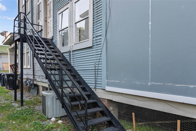 view of side of home with cooling unit