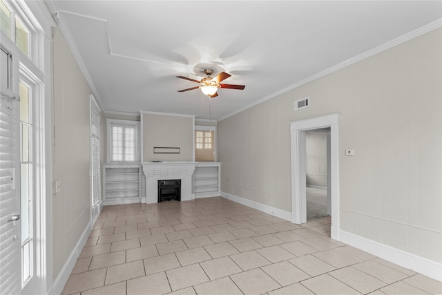 unfurnished living room featuring ceiling fan, light tile patterned floors, and crown molding