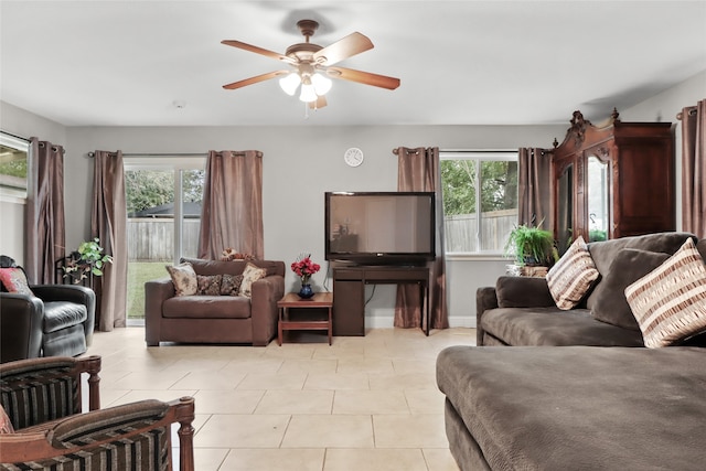 tiled living room featuring ceiling fan and a healthy amount of sunlight